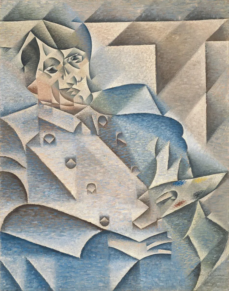A portrait of Picasso holding a palette, broken into angled planes of blue and gray