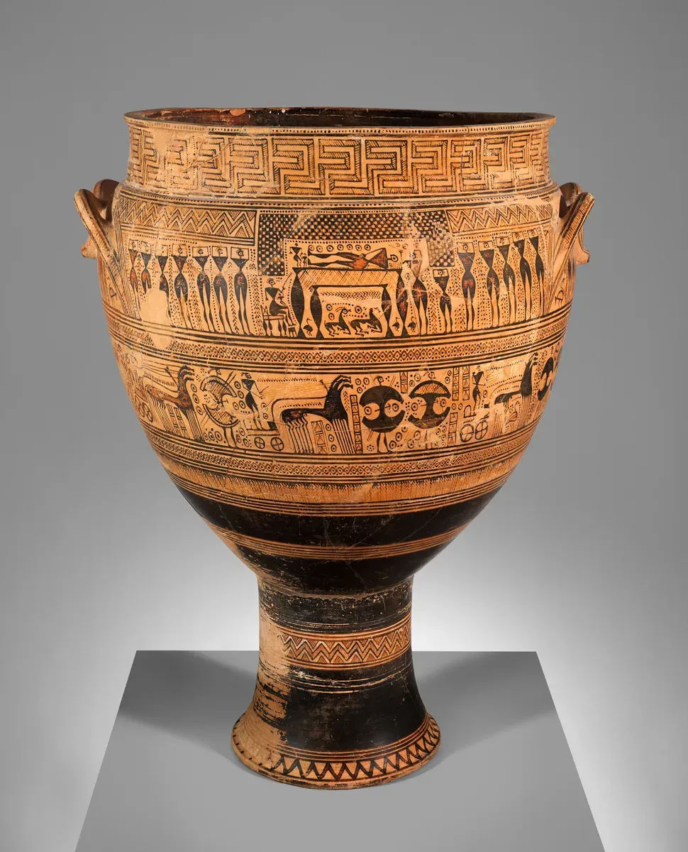 Tall Greek pot covered in bands of zigzag patterns with a frieze of tiny dark silhouette figures and horse-drawn chariots