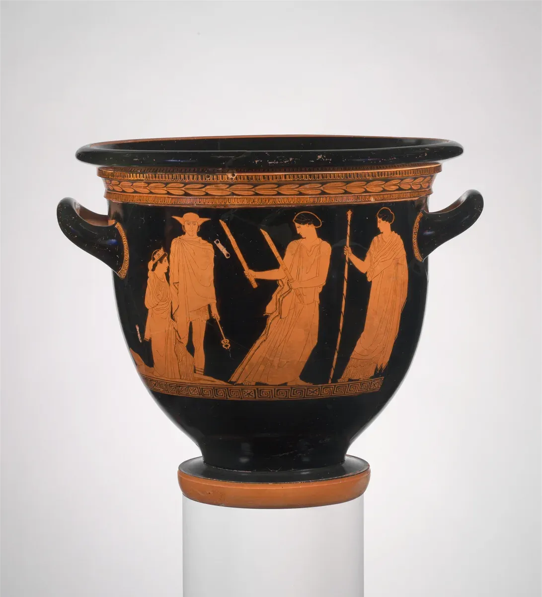 Red-figure vase: a young woman rises from the earth while a woman with two torches lights her way and a man with a staff looks on