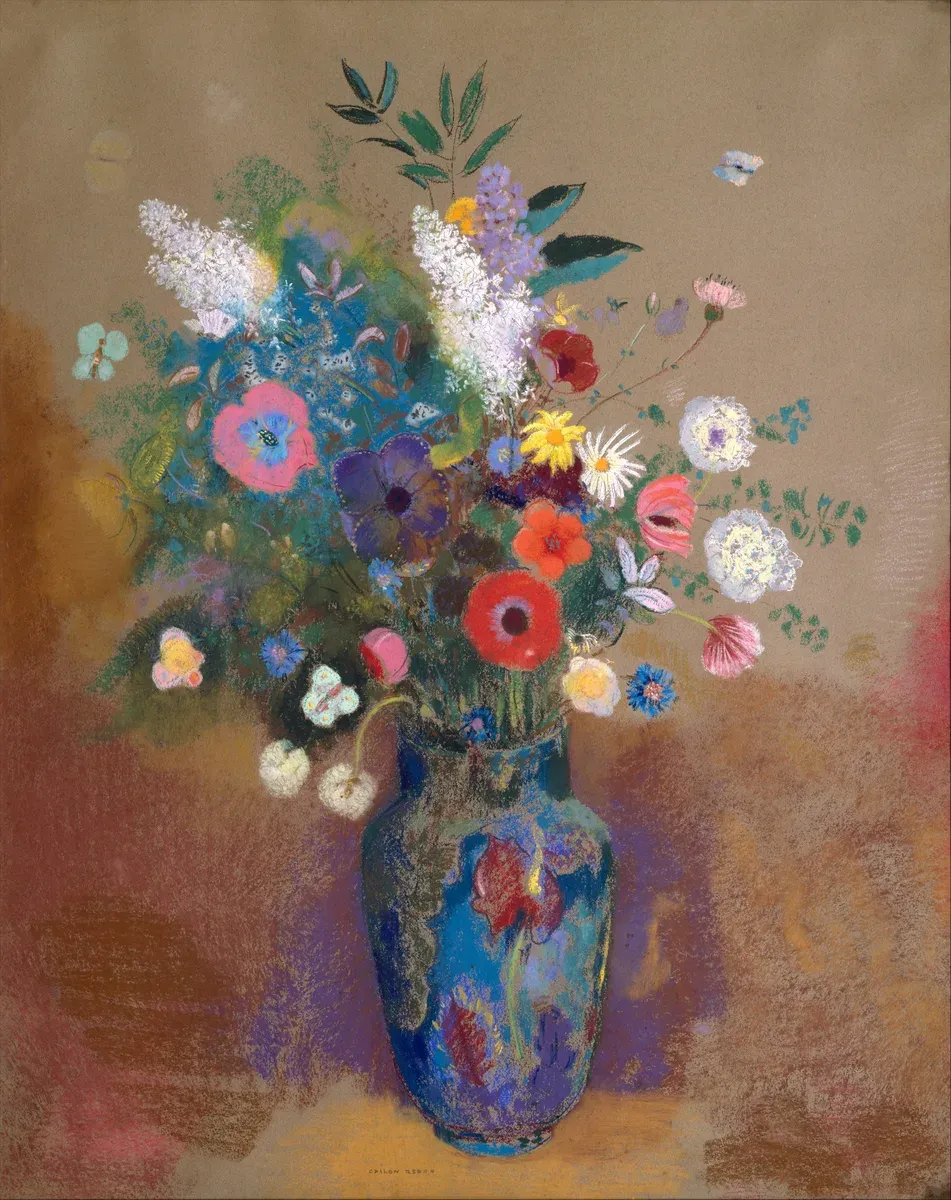 A bouquet of glowing flowers in a vase against a soft colored background