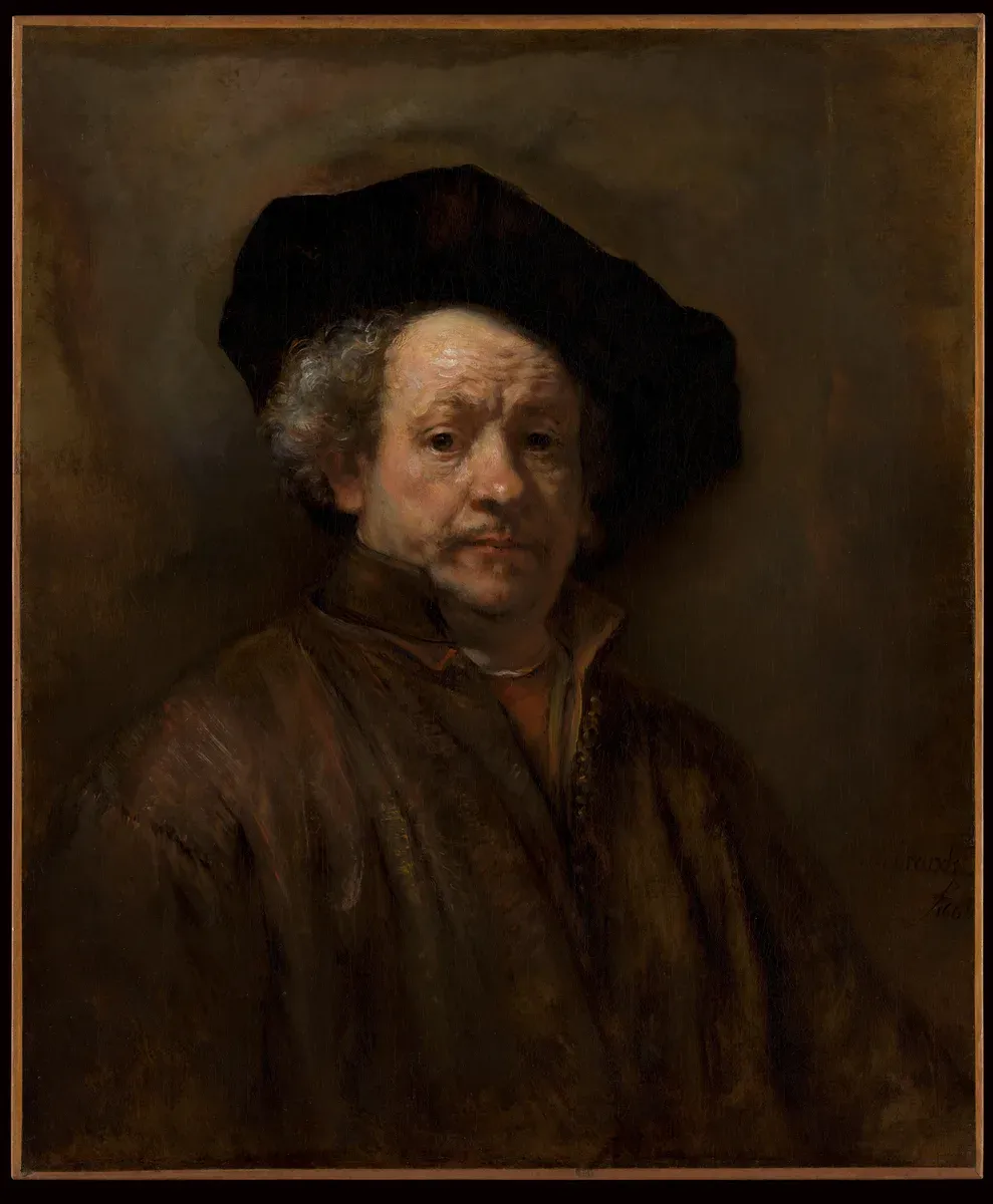 An aging man in a dark beret and coat looks out at the viewer with a lined face