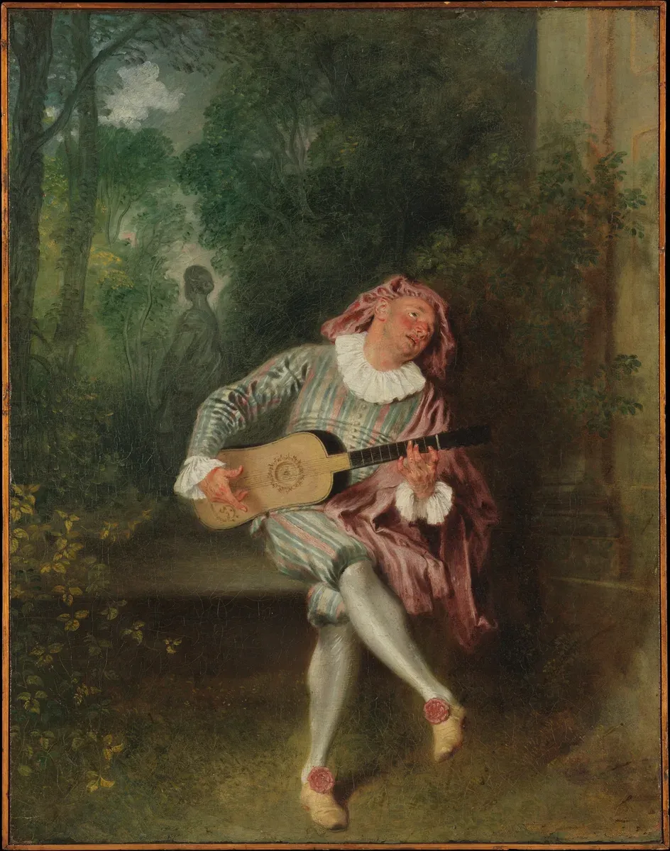 A stage character in a striped costume sings to a guitar in a garden