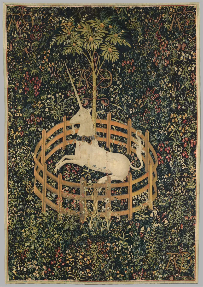 Tapestry of a white unicorn resting in a small round fence under a pomegranate tree