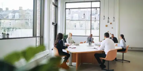 Professional desk with subtle magical elements disguised as ordinary office items